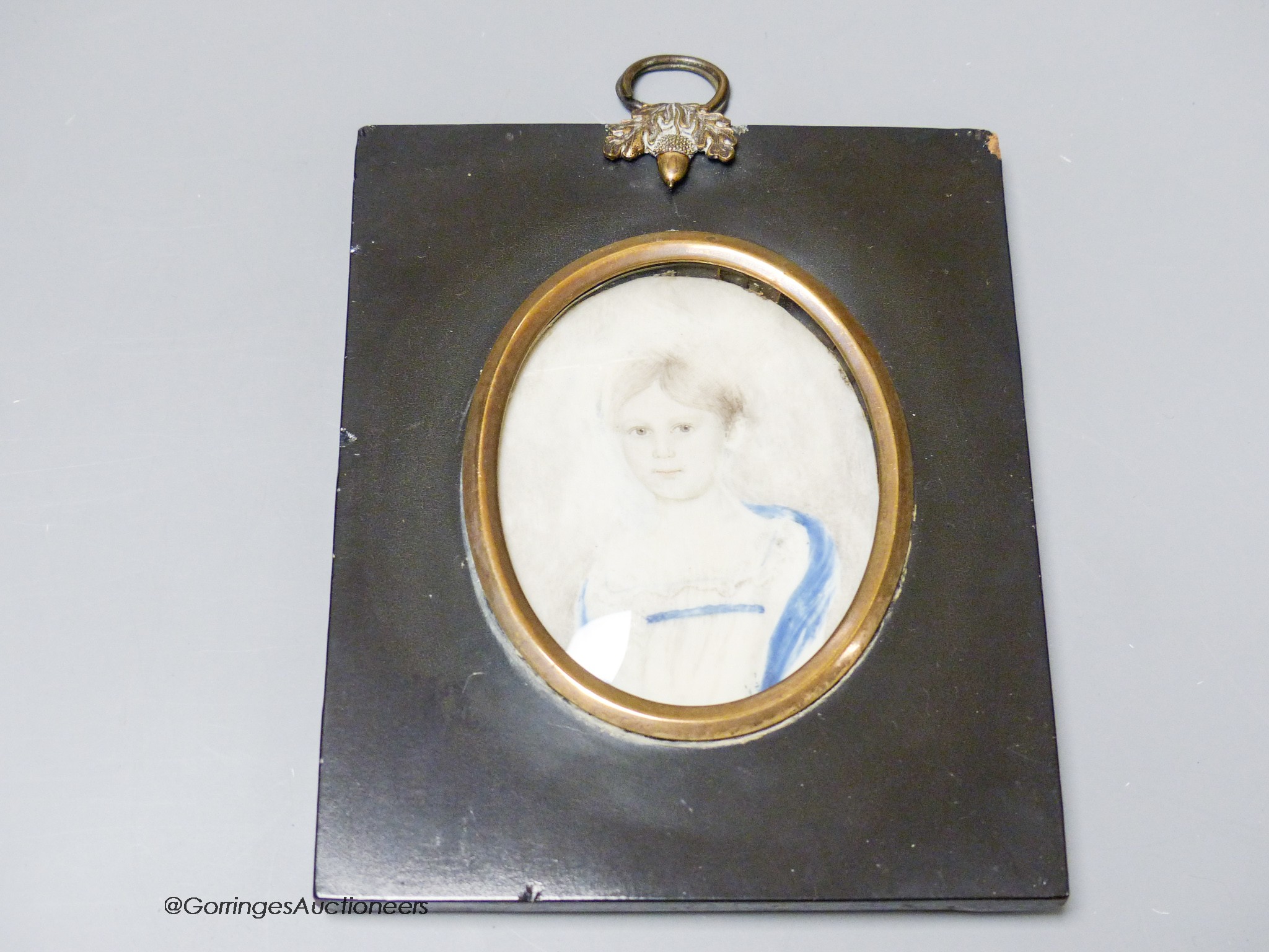 A 19th century portrait miniature of a girl, inscribed verso 'Great Grandmother Machim'